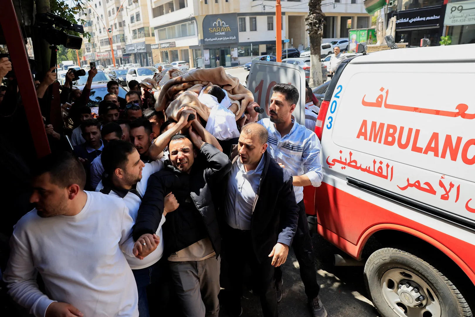 Palestinians mourn football loving teenager killed by Israeli army