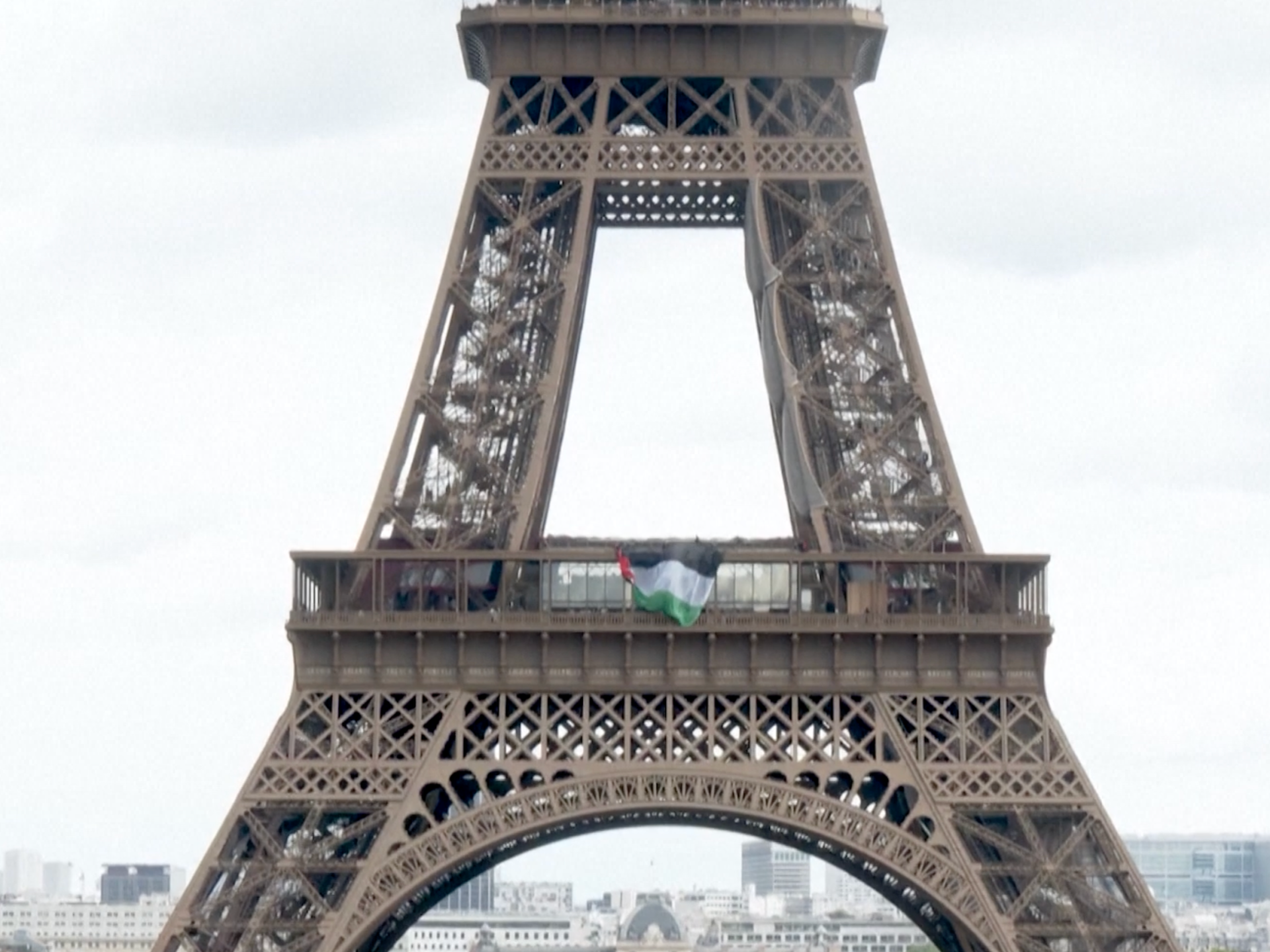 Activists hang Palestinian flag on the Eiffel Tower for Nakba Day