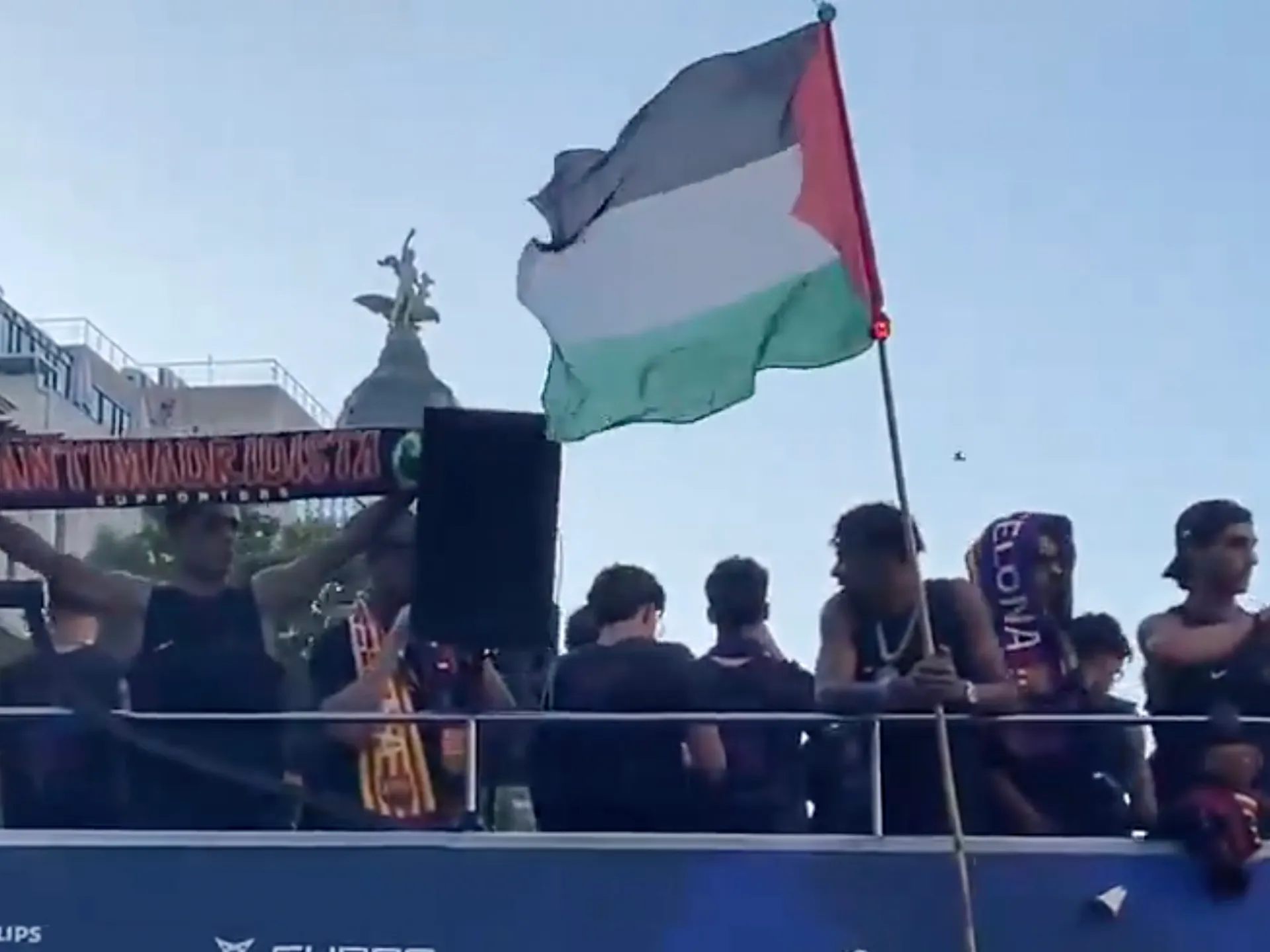 Barcelona player Lamine Yamal waves Palestinian flag at parade