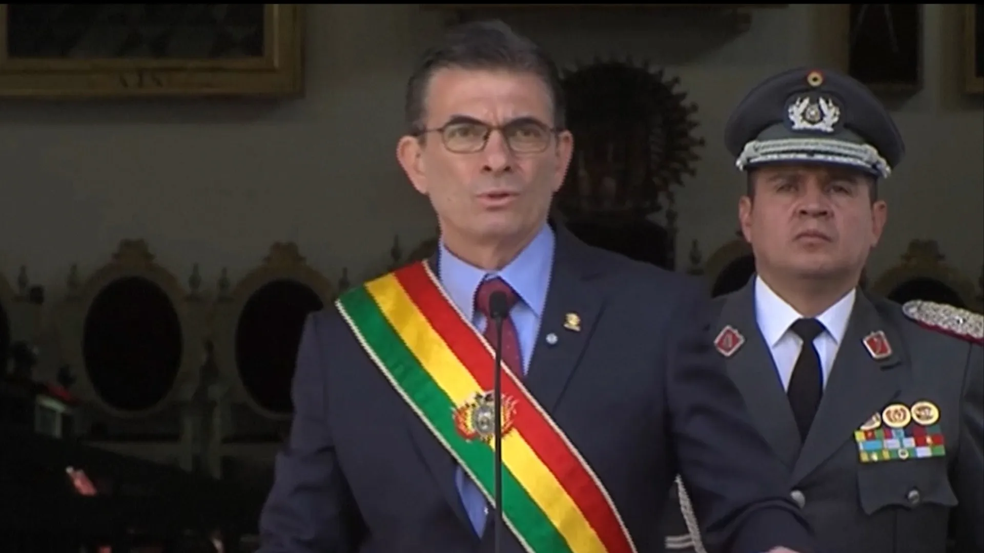 Bolivia’s president cuts salary in half amid protests