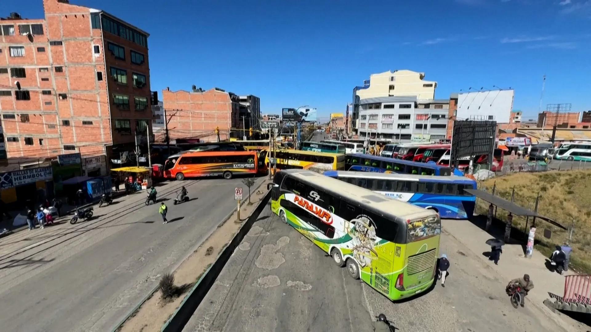 Buses block off roads in Bolivia as transport workers strike over fuel