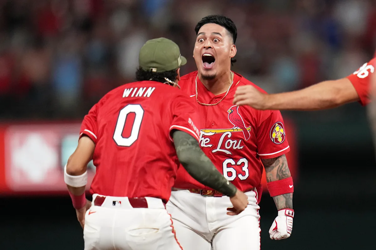 Pozo's hit in 11th lifts Cardinals over Royals, setting off celebration among shirtless fans