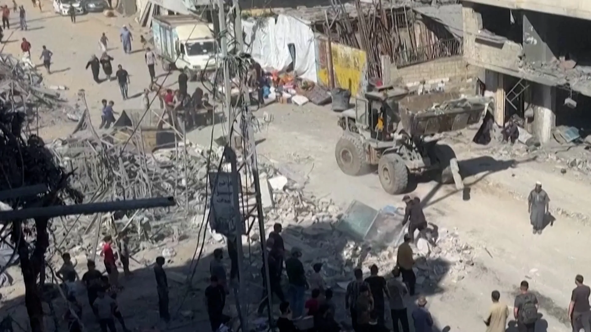 Families clear rubble after overnight Israeli strikes in Gaza
