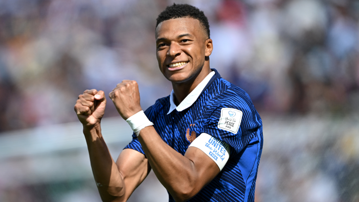 Kylian Mbappe shines as France overcomes two-hour weather delay to beat Iraq