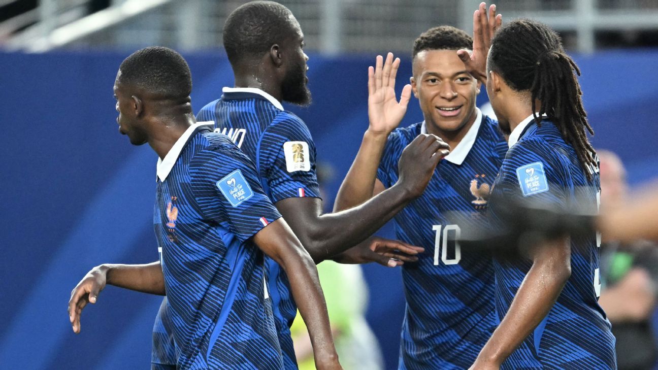 Mbappé makes it rain as storms delay France win