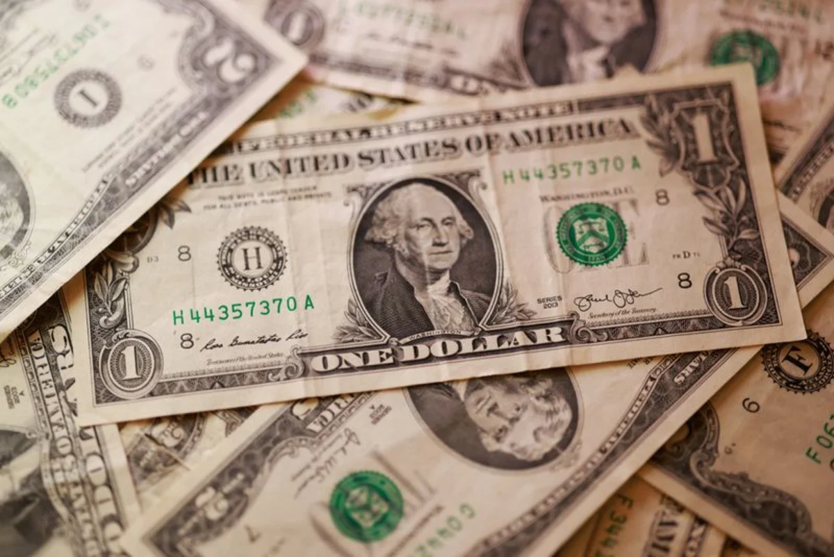 Dollar softens as investors weigh Middle East jitters against inflation data