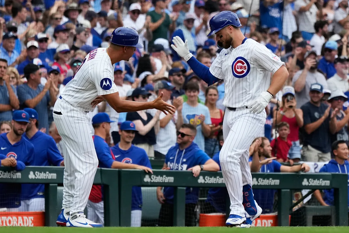 Former Cubs player Anthony Rizzo snares Michael Busch's home run ball in the Wrigley Field bleachers