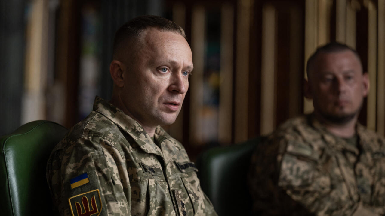 Ukrainians welcome new army chief but seek return of fired defence minister