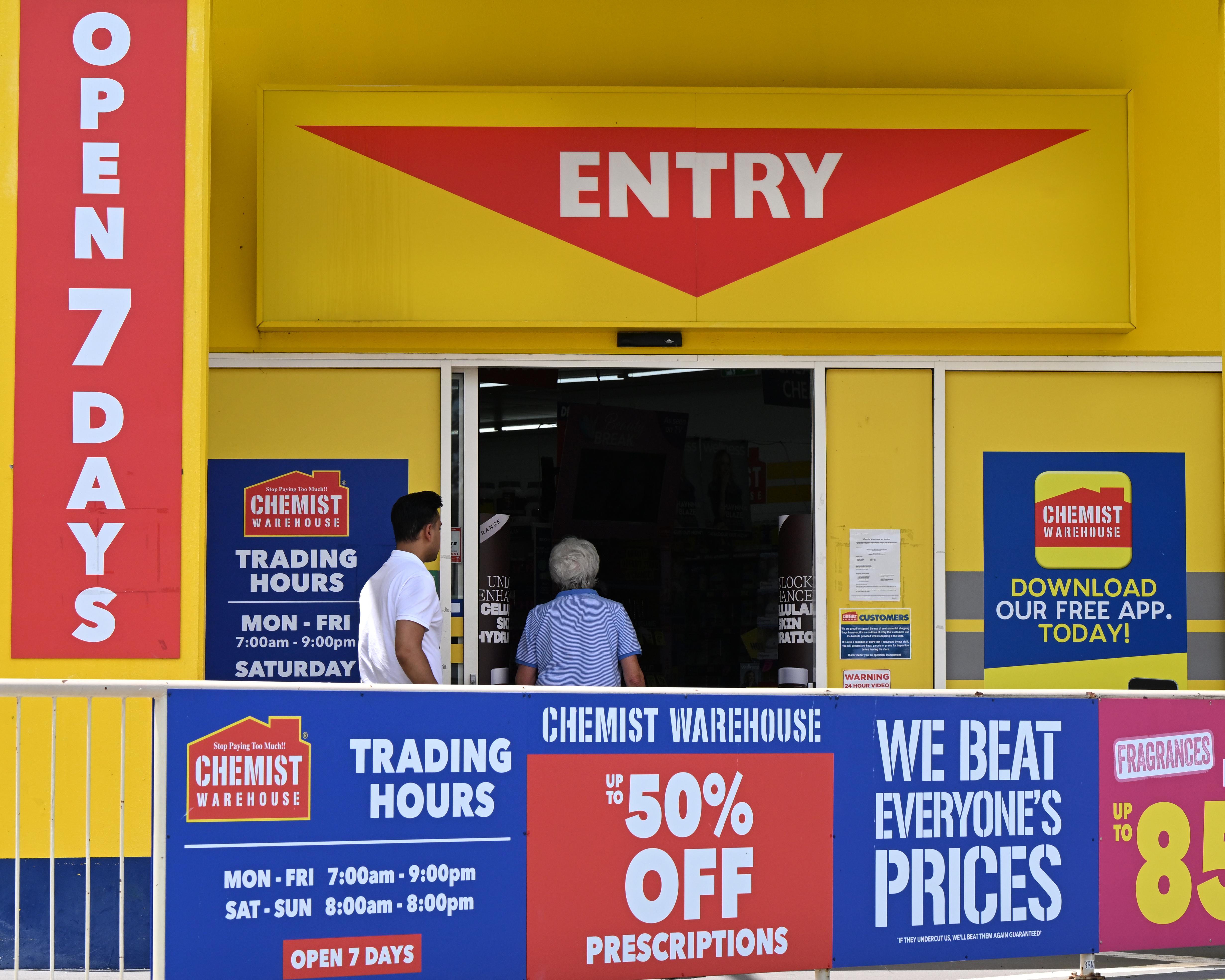 Neon signs, tiny aisles and the ambience of a panic attack. Britain, are you ready for the Chemist Warehouse experience?