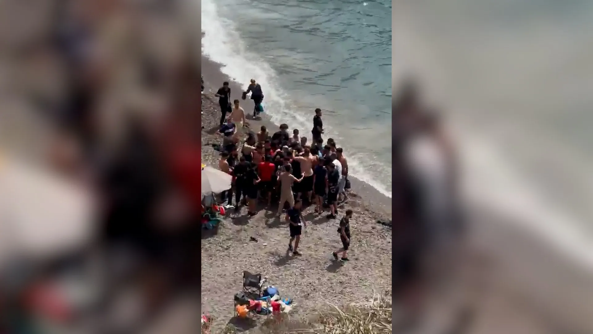 Dozens of migrants land on Spanish coast surprising beachgoers