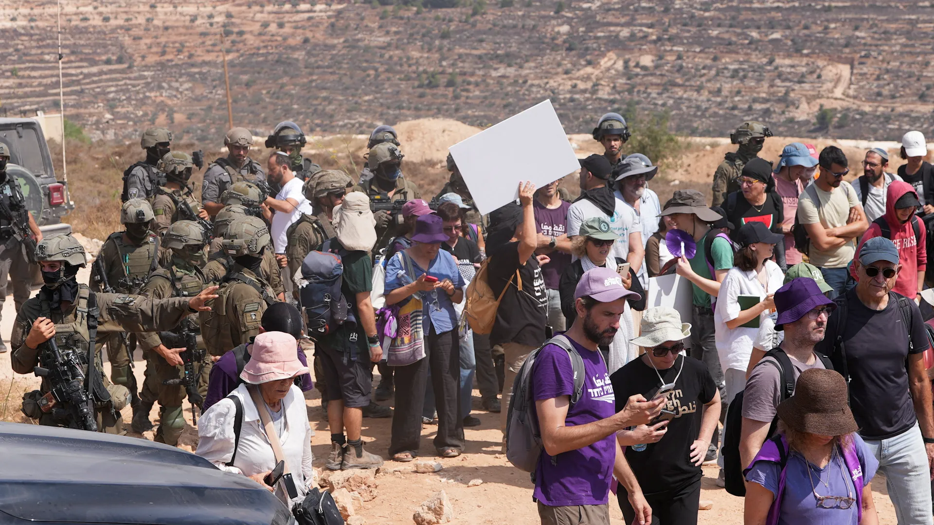 Israeli soldiers prevent aid delivery to besieged Palestinians