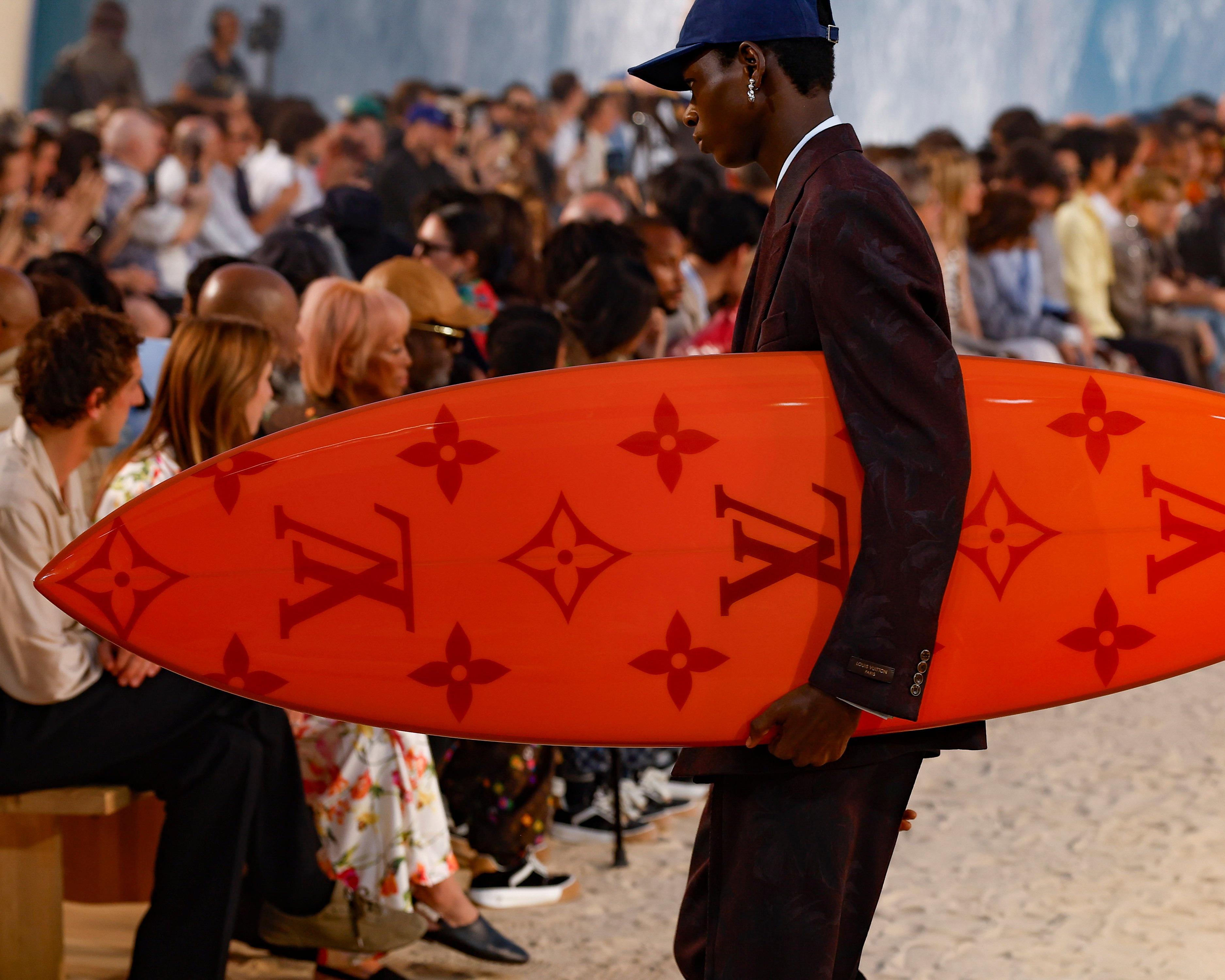 Louis Vuitton brings the beach to Paris in near 40C heat
