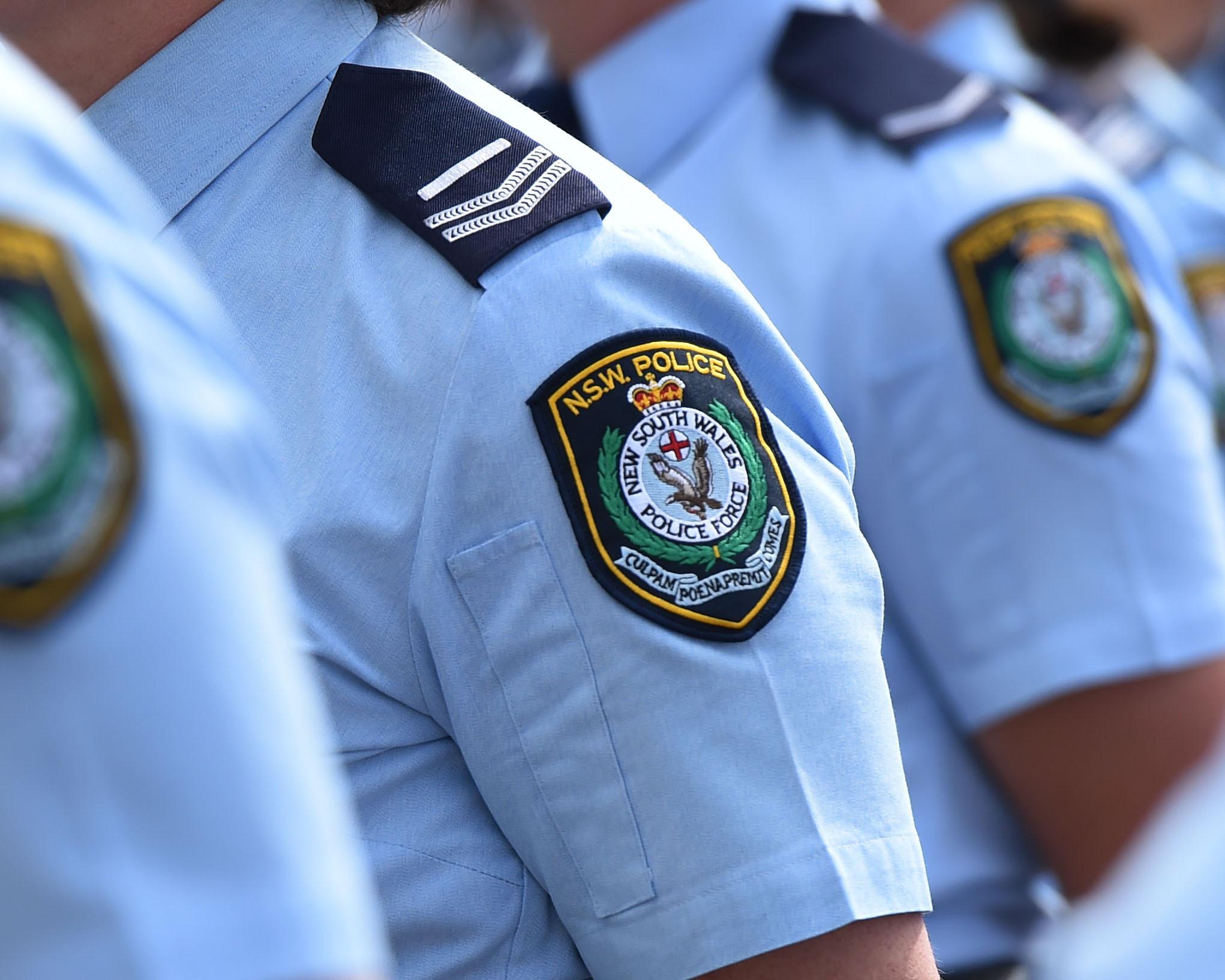 Man arrested over alleged offensive shirt outside royal commission venue – as it happened