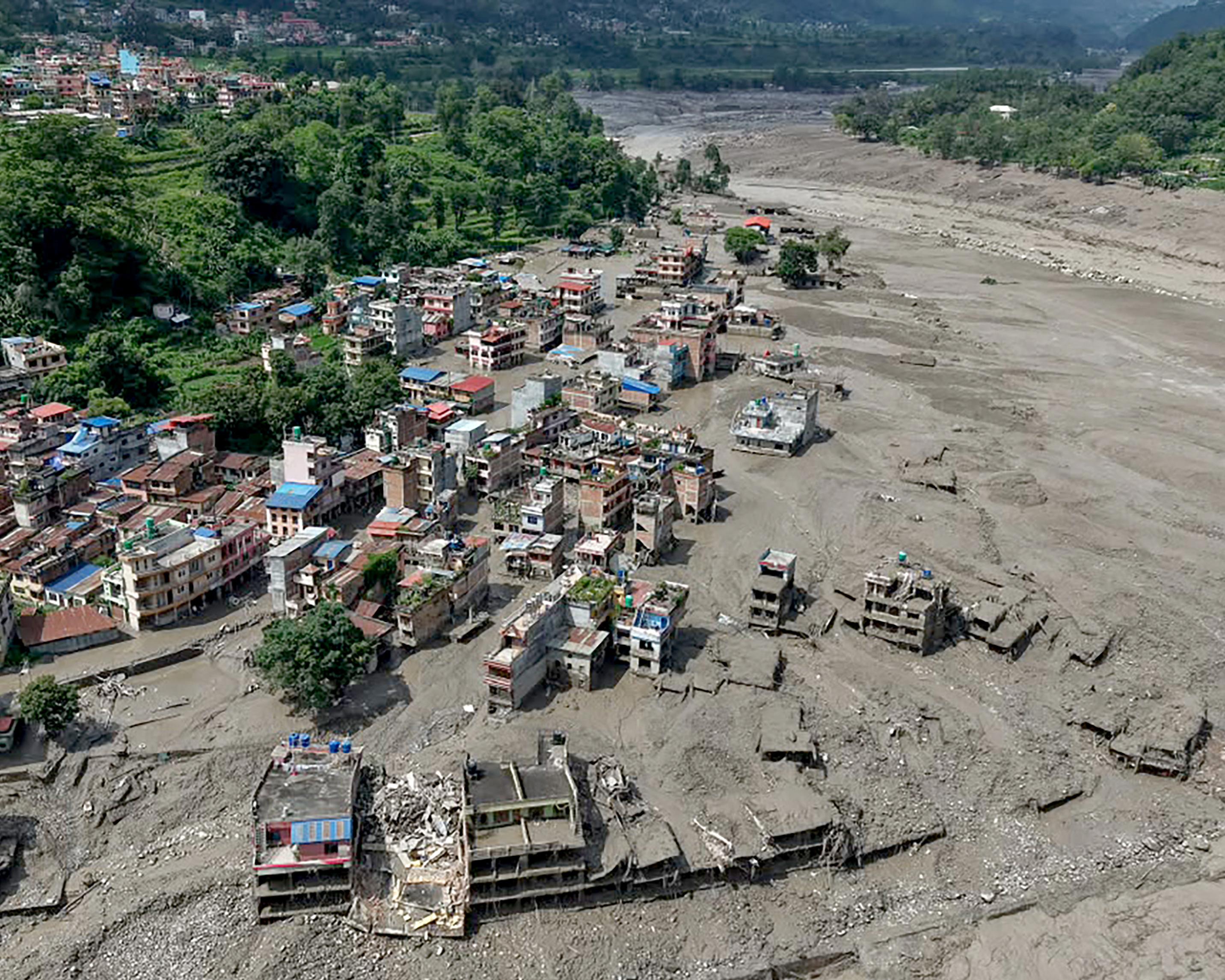 News live: dozens of Australians believed to be among hundreds missing in Nepal flash floods