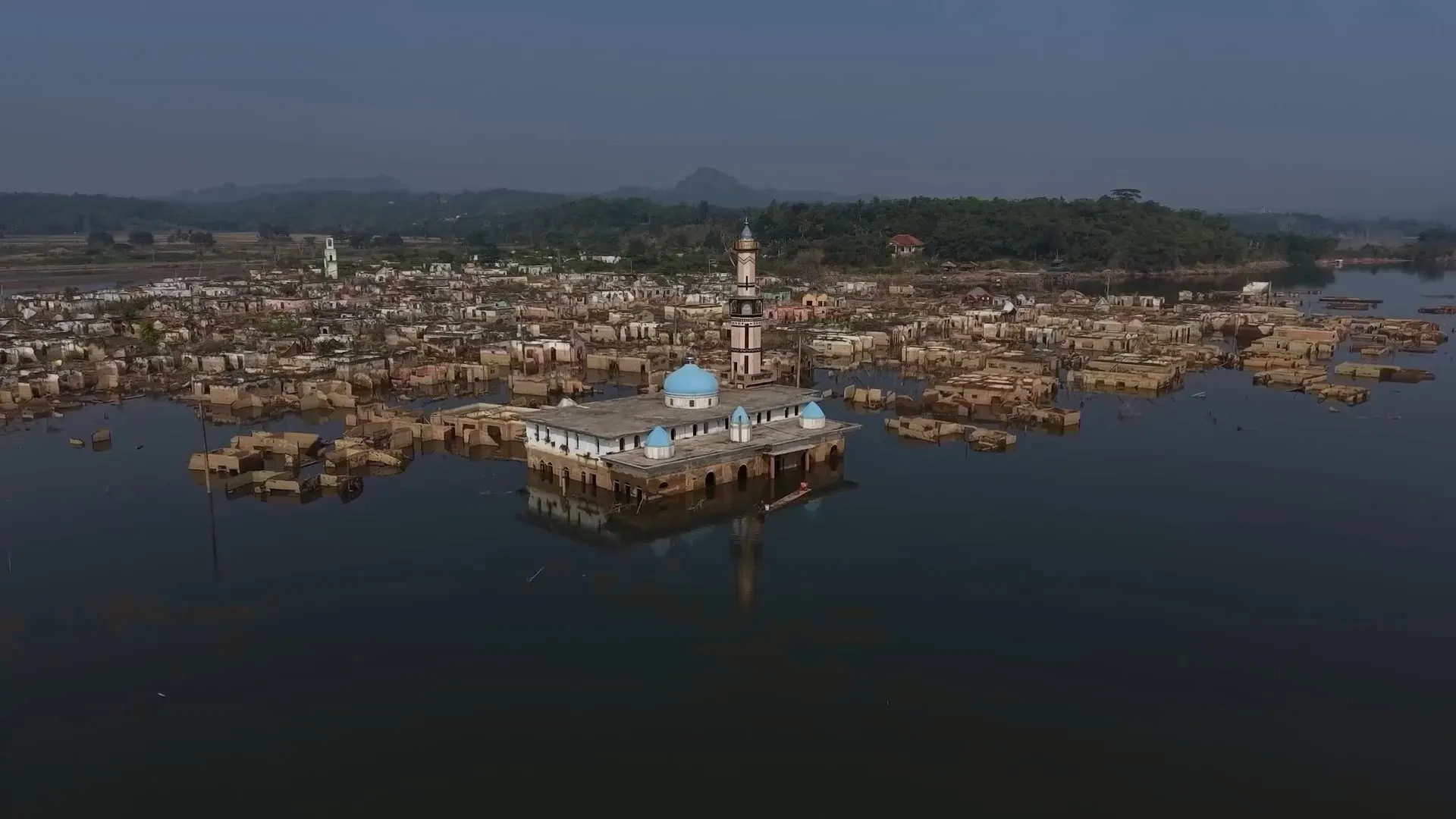 Submerged Indonesian village re-emerges as drought lowers water levels