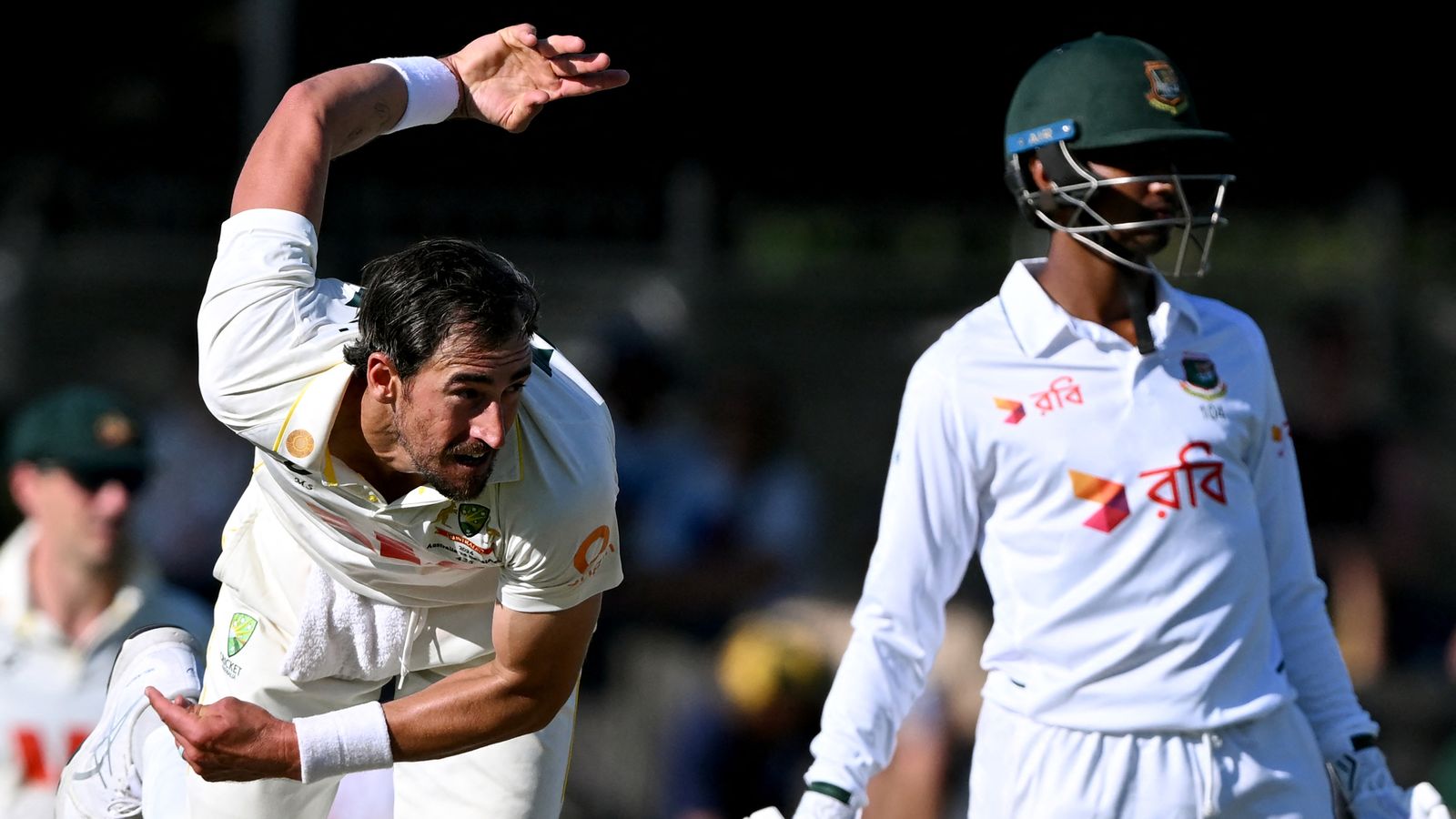 Tempers flare as Australia toil after Hasan's maiden Test ton