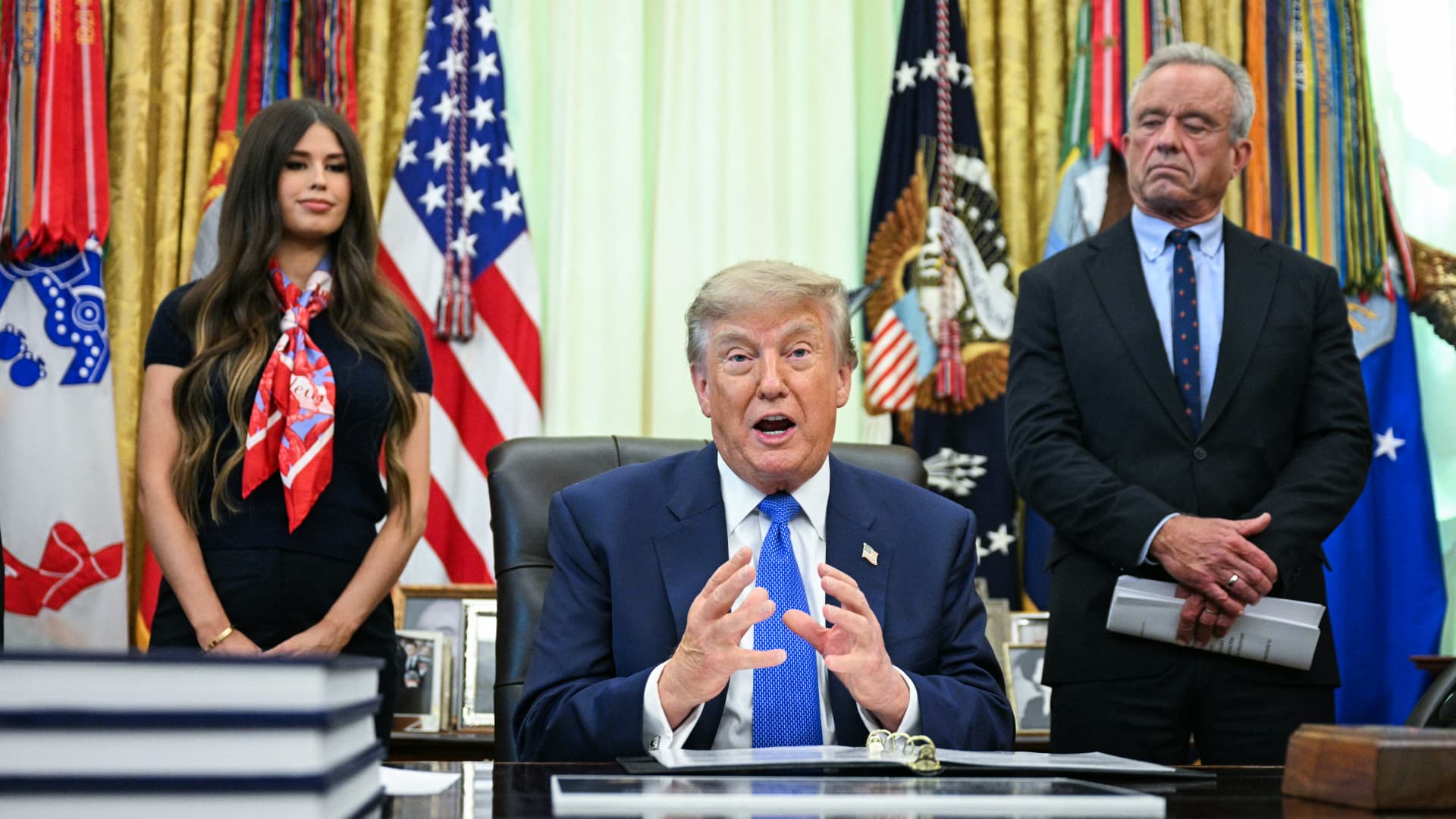 Trump signs executive order calling for fewer childhood vaccines, falsely linking shots to autism