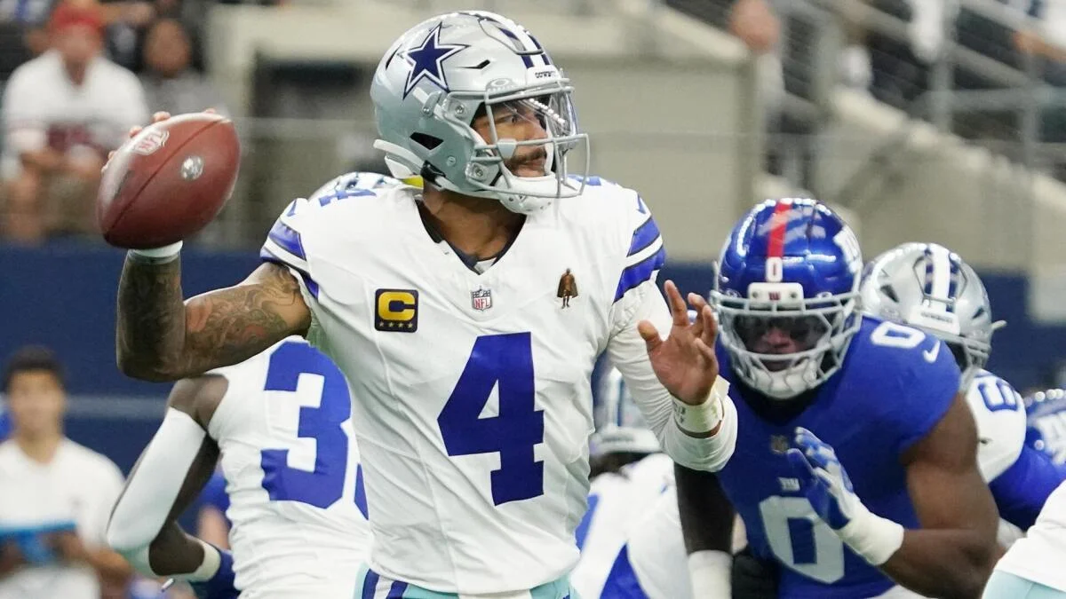 Dallas Cowboys quarterback throws a football during an NFL game against the New York Giants