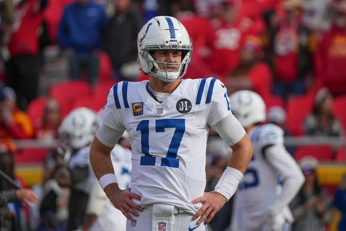 Colts player wearing number 17 stands with hands on hips during a football game
