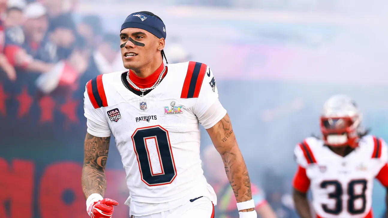 New England Patriots player wearing number 0 stands on the field in uniform