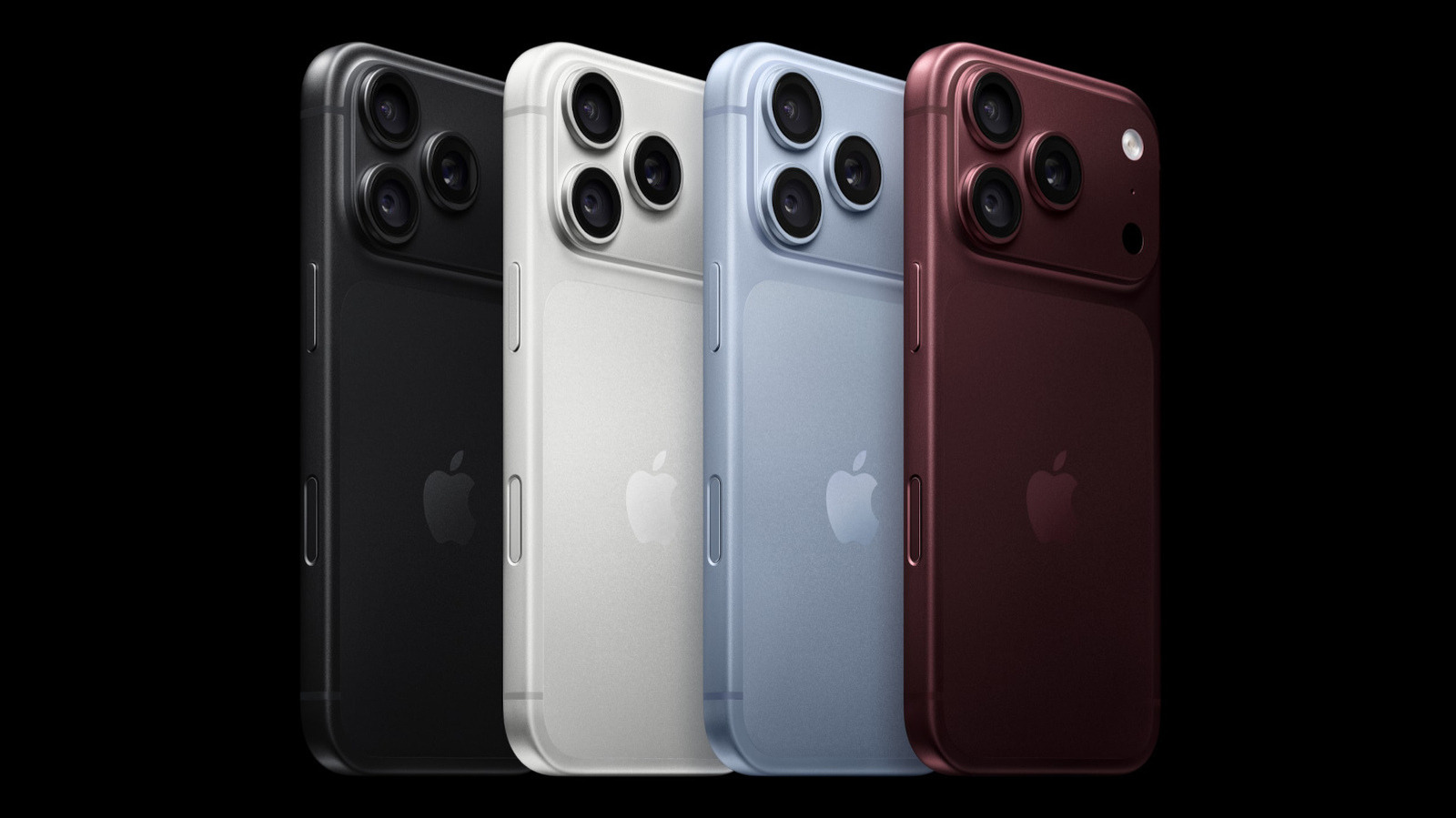 Four iPhones shown from the rear in black, white, blue, and red finishes.