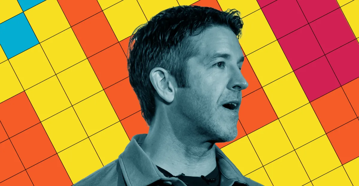 Blue-tinted side profile of a man against a bright geometric grid of colorful squares