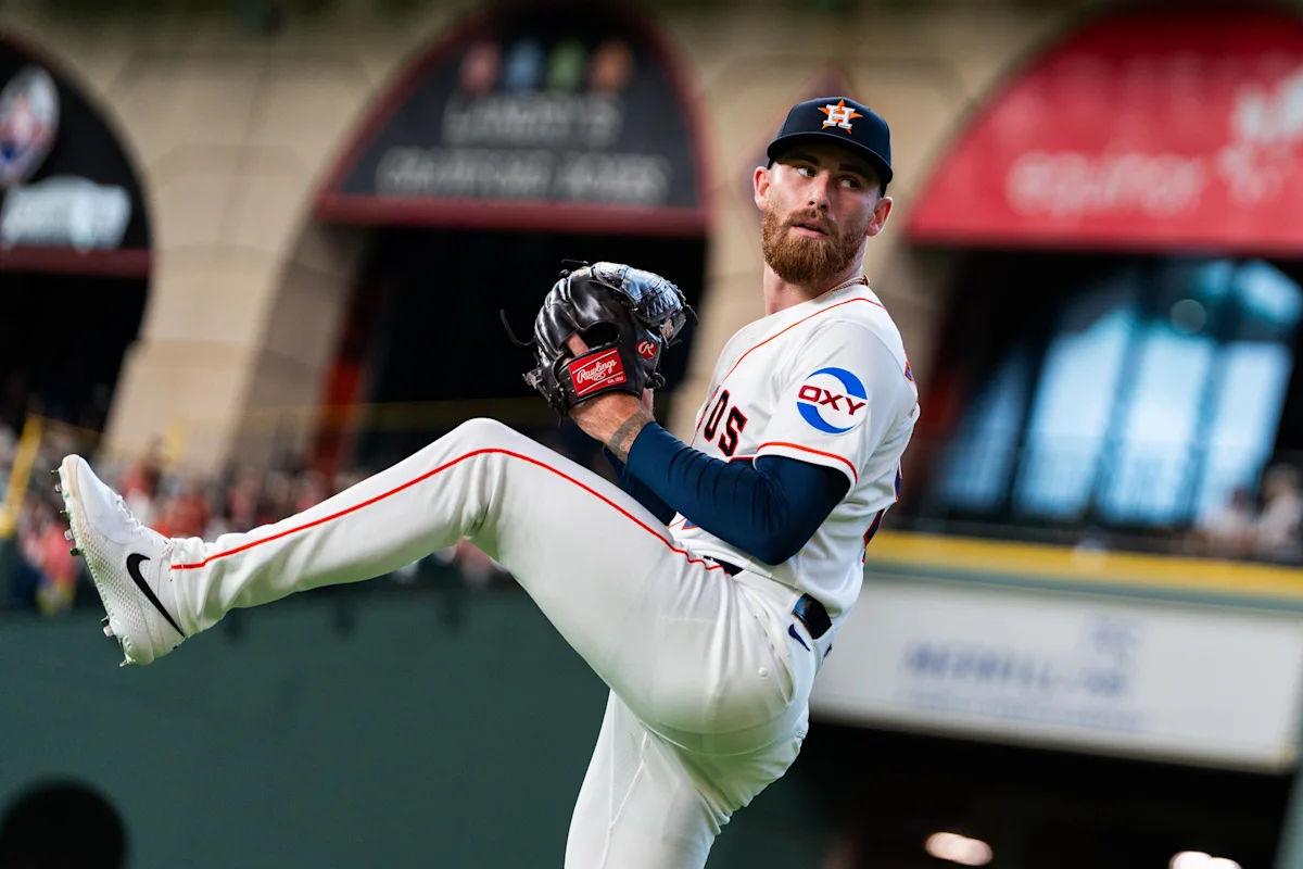 Houston Astros pitcher lifts his leg while preparing to deliver a pitch