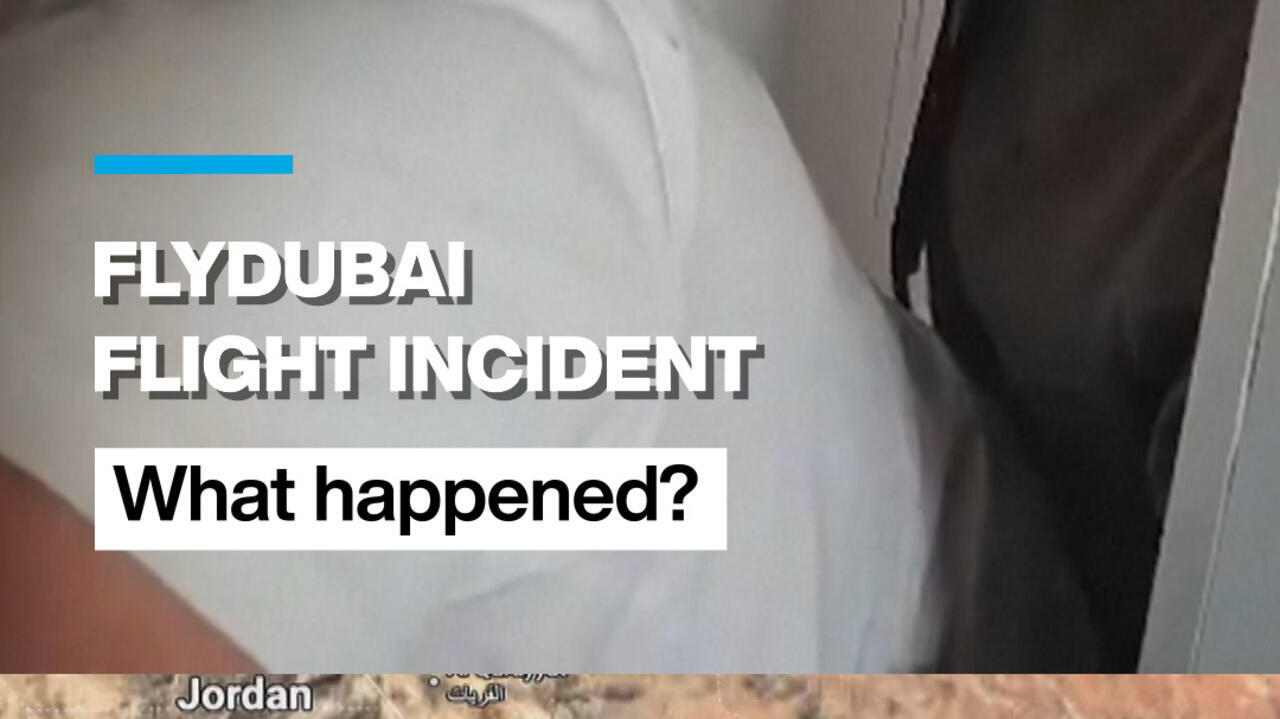 News graphic reading “Flydubai flight incident” and “What happened?” over a close-up of a person in white clothing.