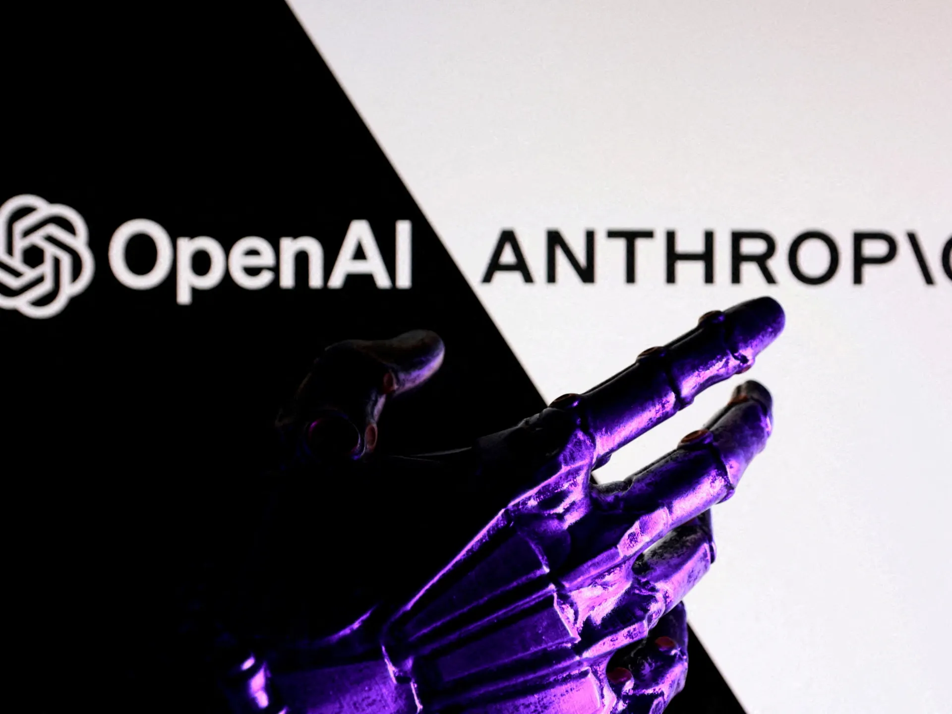 Purple-lit robotic hand reaches across a split black-and-white backdrop with OpenAI and Anthropic logos.