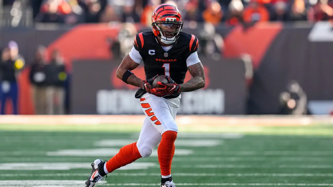 Cincinnati Bengals player wearing number 1 runs with the football during an NFL game.