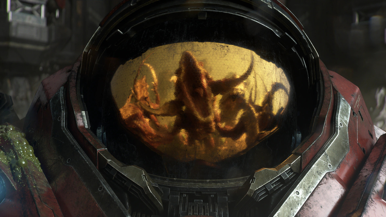 Close-up of a futuristic armored helmet with a gold-tinted visor reflecting an indistinct figure.