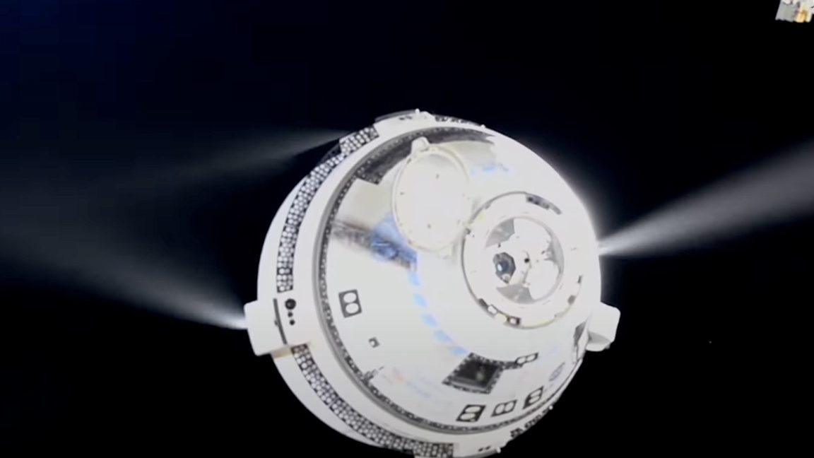 A white crew capsule floats against a black background, with narrow jets visible on either side.