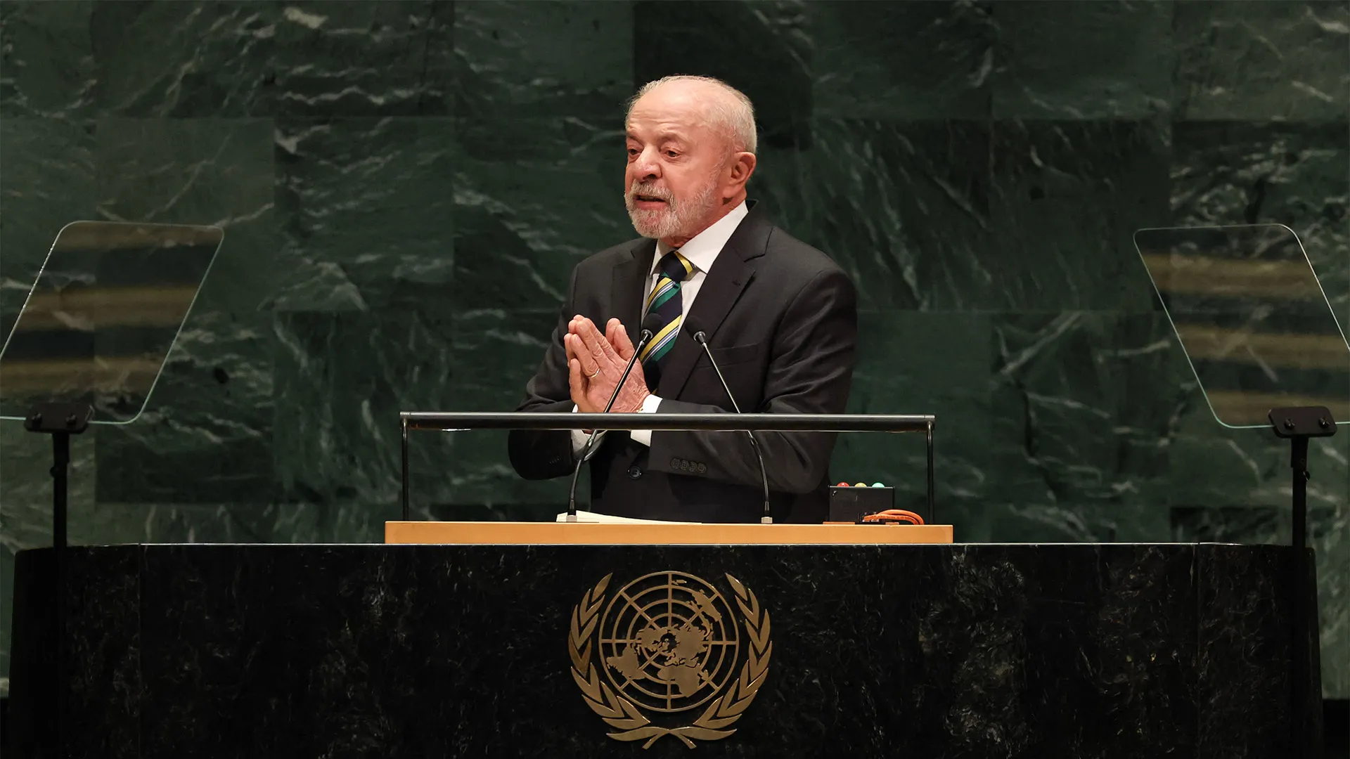 Brazilian president speaking at a lectern before the United Nations emblem and teleprompters