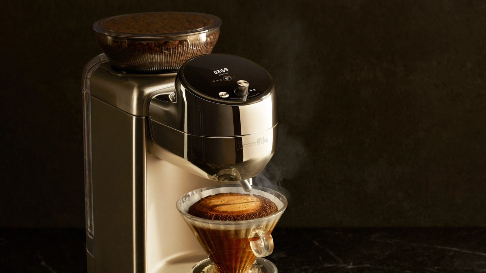 A stainless steel Breville coffee machine pours hot water over grounds in a glass dripper.