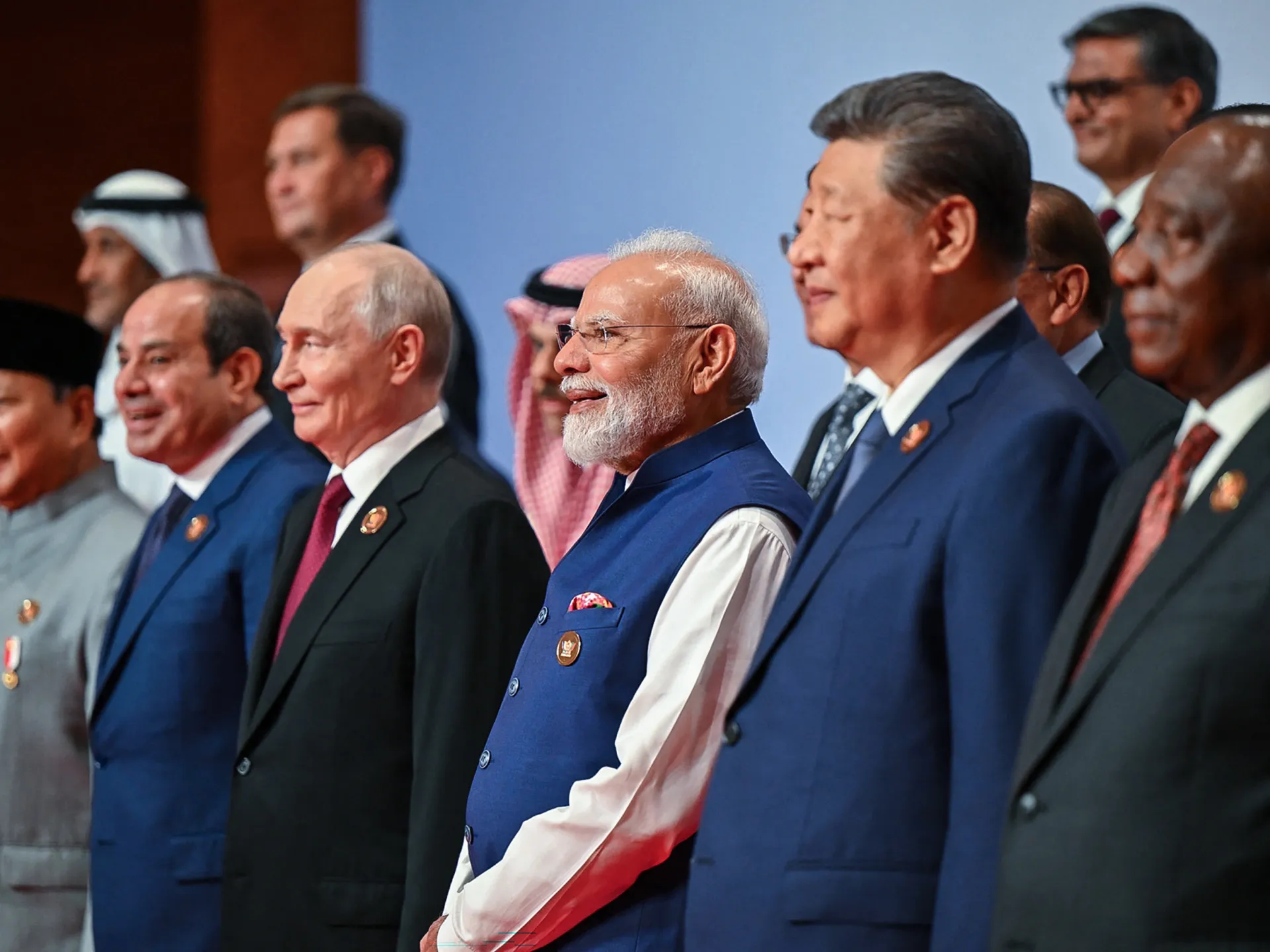 Group of international leaders standing together at a formal summit, including several prominent political figures.