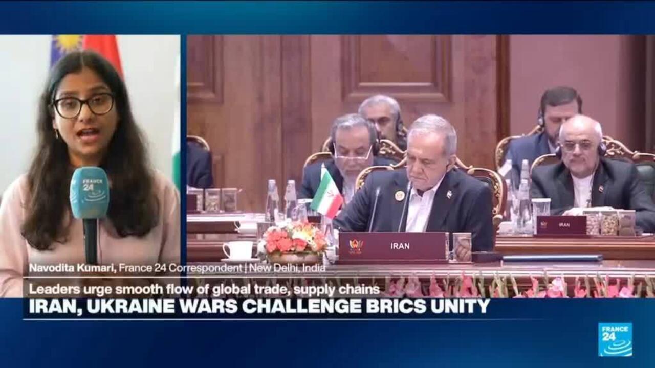 Split-screen news broadcast showing a reporter beside an Iranian delegation seated at a summit table.
