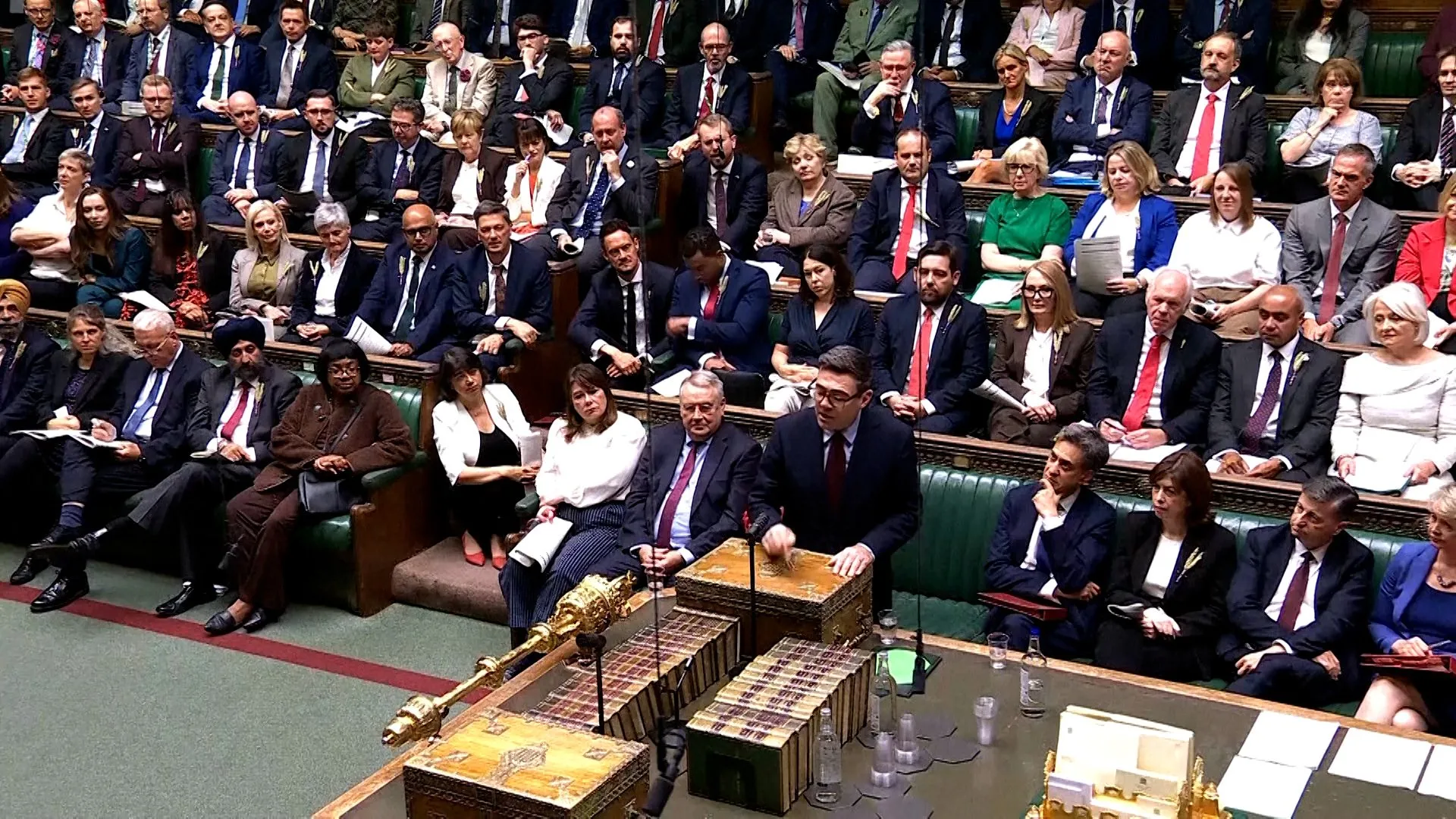 Politicians seated in the UK House of Commons chamber as a member speaks at the dispatch box.