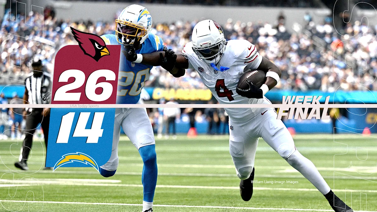 Arizona Cardinals and Los Angeles Chargers players compete during a game, with Cardinals leading 26-14.