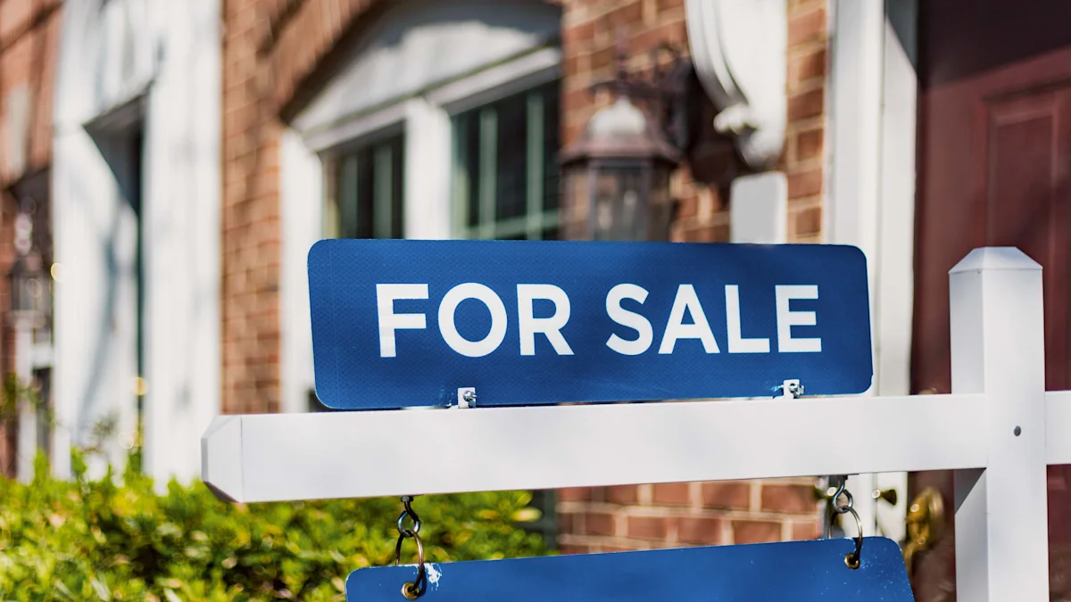 Blue FOR SALE sign displayed outside a brick-front house beside a white post.
