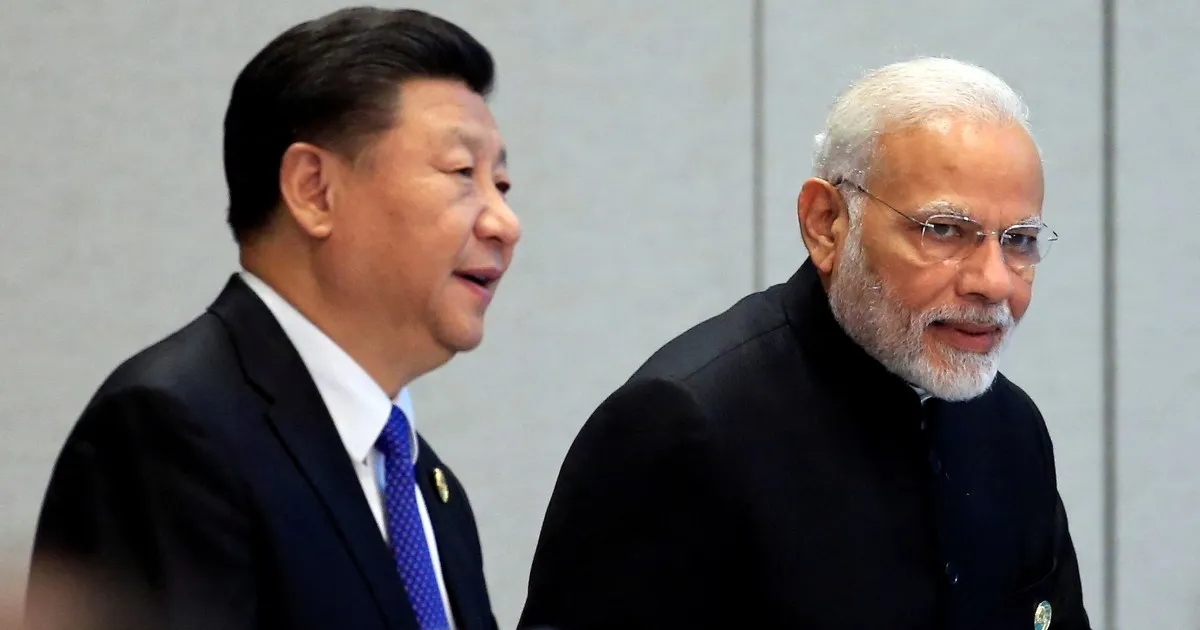 Two suited male leaders walk side by side, one looking toward the other.