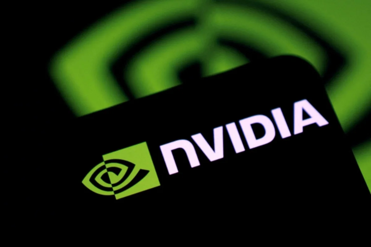 NVIDIA logo displayed on a black surface against a blurred green background.