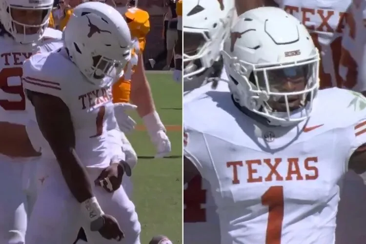 Two Texas football players in white uniforms and helmets shown celebrating on the field.