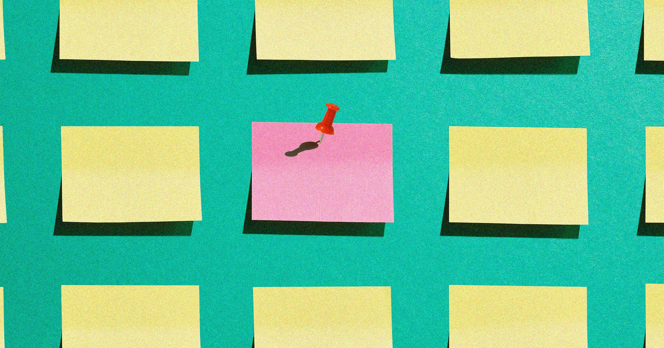 Colorful bulletin board with blank notes, one pink note pinned by a red pushpin.