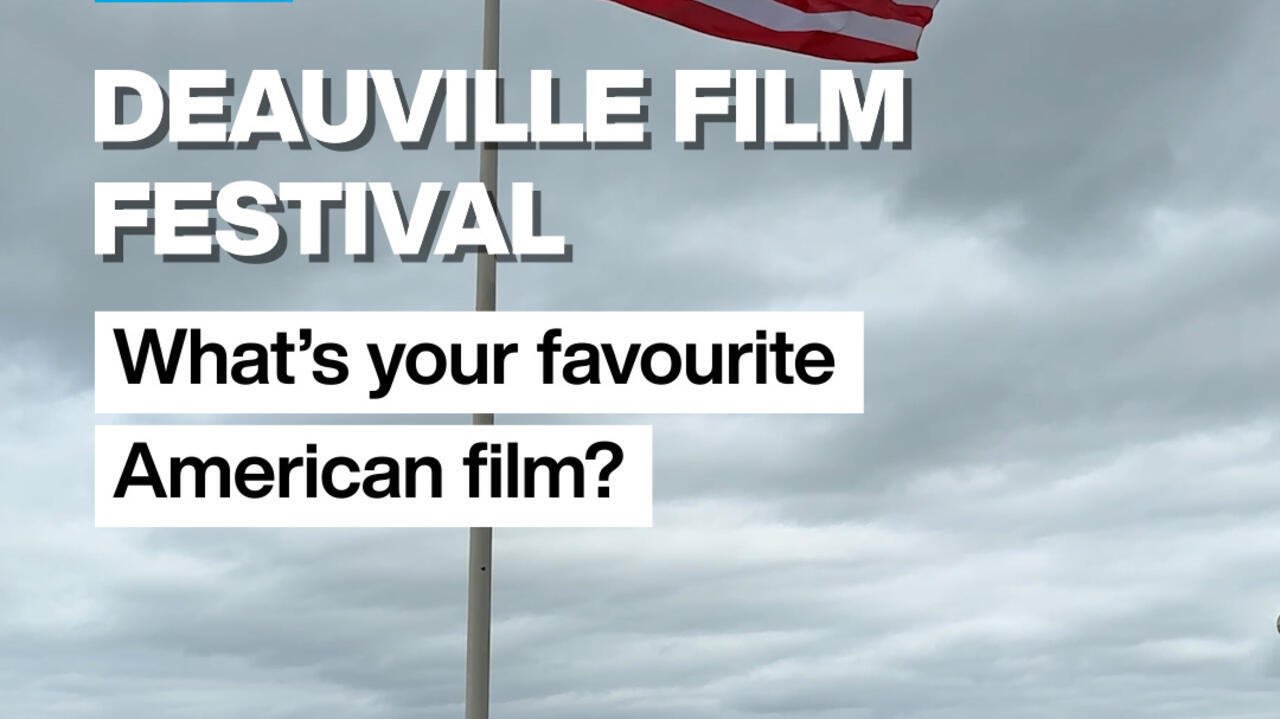 American flag waving above a cloudy sky, with Deauville Film Festival text overlay