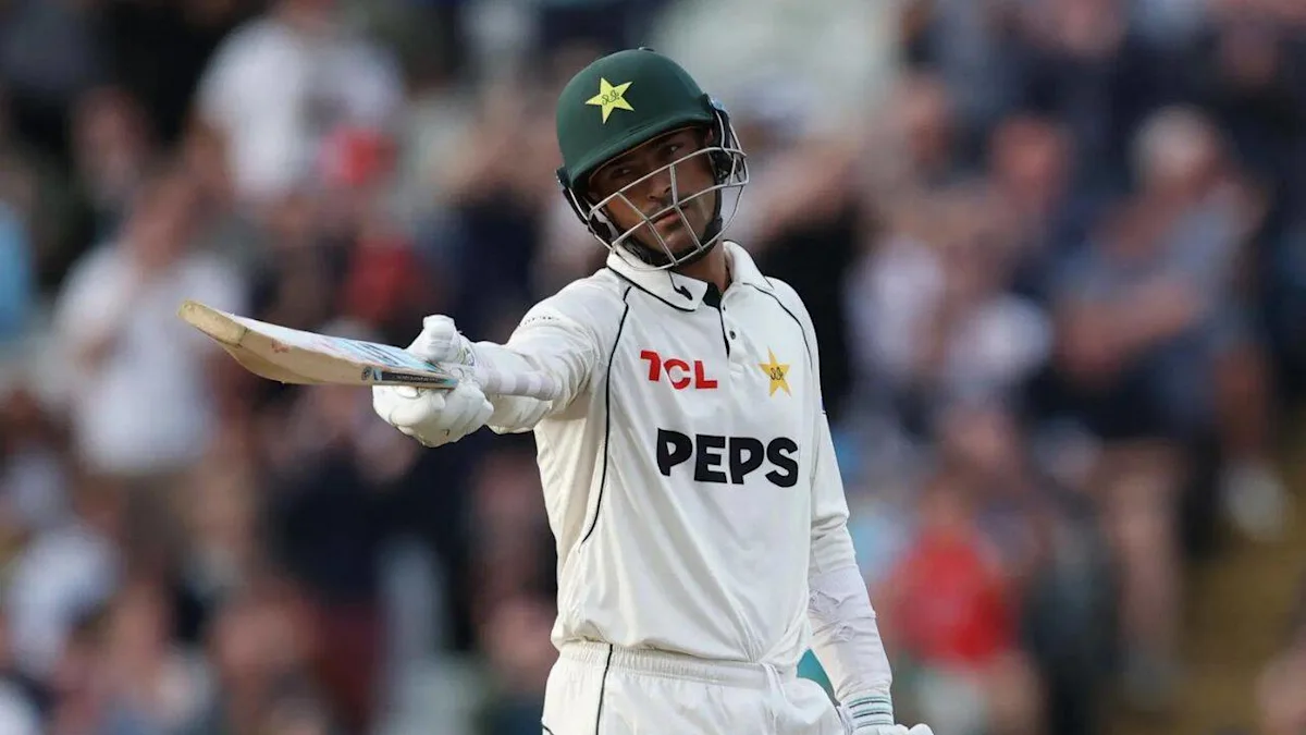Pakistan batsman in helmet extends his bat during a Test match