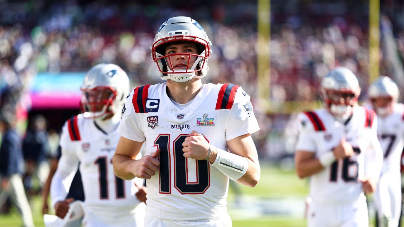 New England Patriots quarterback Drake Maye runs onto the field during a game.