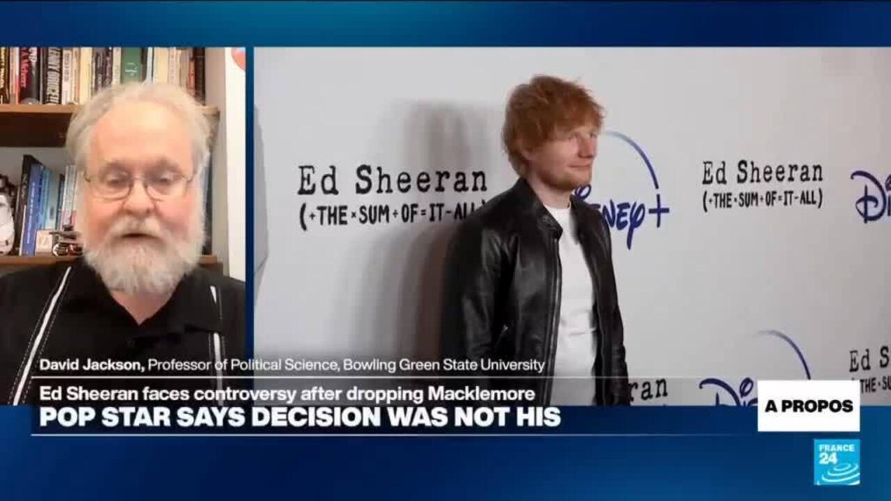 Split-screen news broadcast showing a professor and Ed Sheeran at a promotional event backdrop