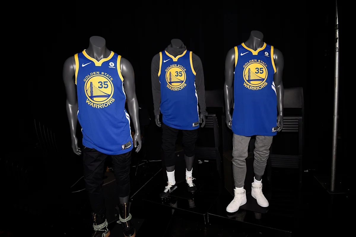Three mannequins display blue and yellow Golden State Warriors No. 35 jerseys with basketball attire.