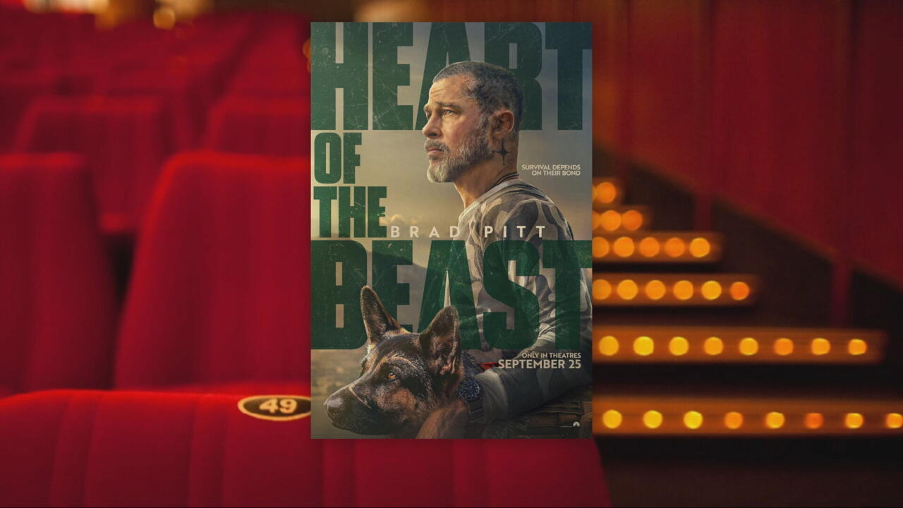 Movie poster shows a bearded man in profile above a German shepherd, with large green lettering.