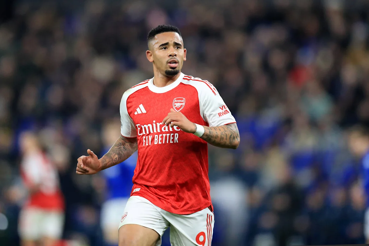 Footballer in Arsenal’s red-and-white kit running during a match